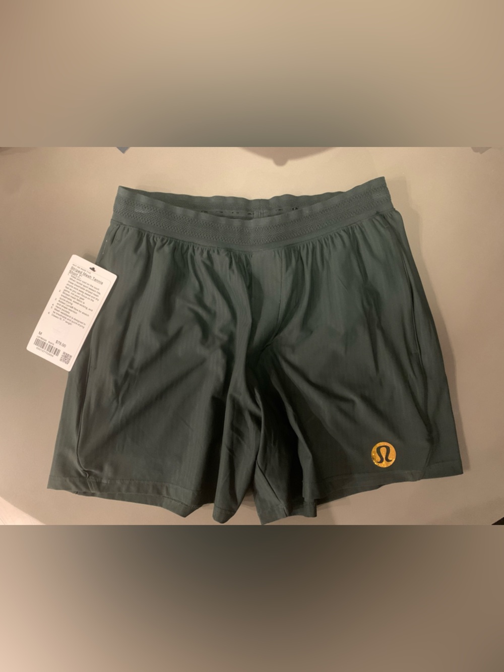 RARE Lululemon Dark Green 5” Tennis Shorts with JUMBO Gold Metallic Logo